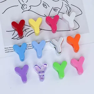 Detailed macro view of colorful 6mm acrylic 'Y' shaped letter beads for DIY jewelry