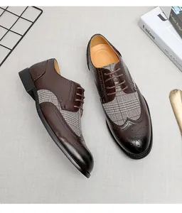 Detailansicht brauner Leder-Brogues mit klassischem Hahnentrittmuster-Stoffeinsatz