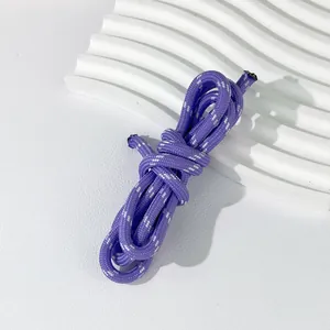 Macro detail view of 5mm purple woven polyester cord for DIY lanyards and bracelets.