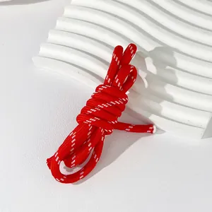 Close-up of 5mm red and white woven polyester cord for DIY bag charms and bracelets