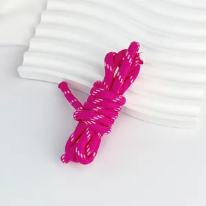 Close-up detail of 5mm pink braided polyester cord with white dots for DIY crafts.