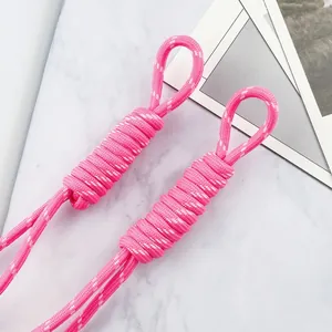 Close-up view of pink 5mm braided paracord loops for DIY bag charms and keychains