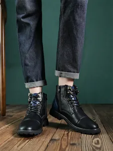 Detailed view of men's vintage British style black leather high-top Martin boots.