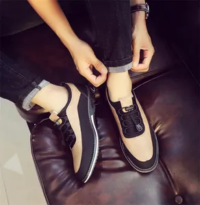 Close-up detail of men's breathable slip-on loafers in stylish khaki and black color