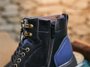 Close-up detail of retro leather Martin boot with side zipper and metal eyelets