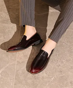 Close-up detail of high-end men's burgundy gradient patent leather slip-on loafers