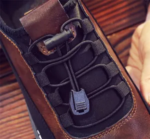 Close-up detail of breathable men's loafer with quick-lace elastic cord system