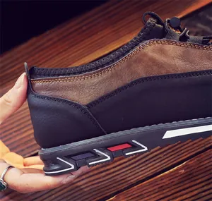 Close-up of breathable brown leather men's loafers with a durable patterned sole.