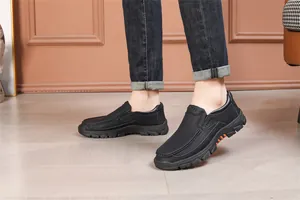 Close-up of premium black leather slip-on shoes for men, featuring a durable rubber sole