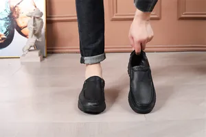 Close-up of classic black leather slip-on loafers for men with textured finish