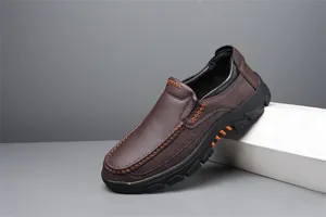 Men's brown pebbled leather slip-on shoes with orange stitching details