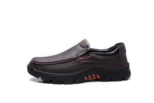 Detailed side view of brown leather men's slip-on loafers with orange stitching