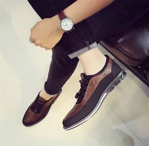 Detailed view of breathable men's leather loafers with elastic laces and brown leather finish