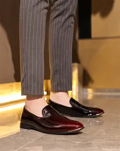 Glossy burgundy men's patent leather loafers slip-on business dress shoes detail view