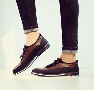 Close-up detail of men's breathable brown and black patchwork casual driving loafers