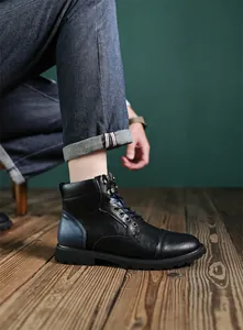 Close-up detail view of retro British style black leather high-top Martin boots for men