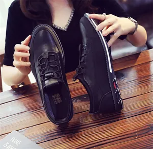 Detail view of black breathable leather loafers with elastic laces and interior label