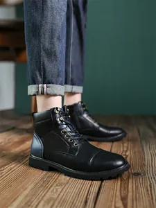 Men's retro British style black leather Martin boots with blue accents worn by model