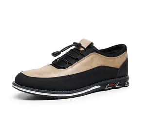 Detailed side profile of a breathable black and tan slip-on men's driving loafer