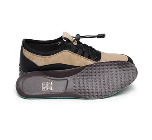 Detail of men's casual slip-on loafers showing tan/black upper and massage insole.