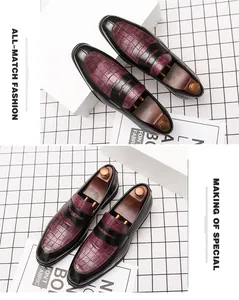 Détail des chaussures pointues pour hommes avec texture en cuir de crocodile bordeaux
