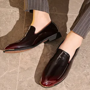 High-gloss burgundy patent leather loafers for men, professional business dress shoes.