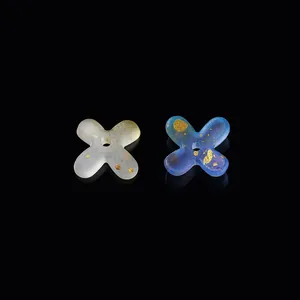 Detailed view of frosted and blue gradient acrylic flower beads with elegant gold foil flecks