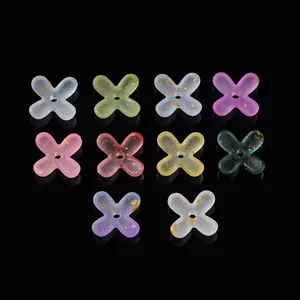 Macro view of colorful translucent acrylic flower beads with gold foil for DIY jewelry