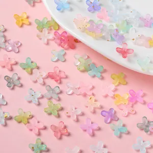 Detailed view of colorful frosted acrylic flower beads with gold flecks for DIY jewelry