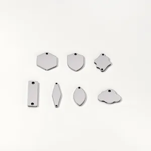 Assorted stainless steel blank tags in various geometric shapes for jewelry making.
