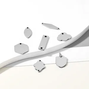 Collection of various blank stainless steel jewelry tags for DIY engraving projects