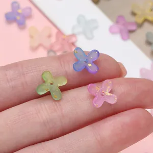 Close-up of colorful gold-flecked acrylic flower beads for DIY jewelry making