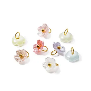 Detail view of colorful iridescent pearl flower pendants for DIY jewelry making