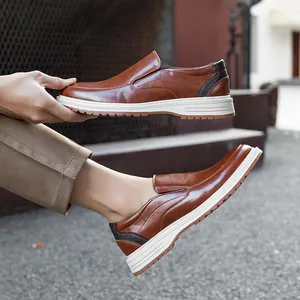 Stylish men's brown leather business casual loafers featuring white contrast soles.