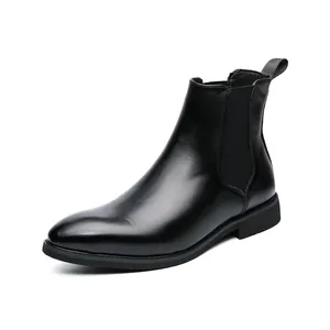 Professional black leather Chelsea boots featuring elastic side panels and back pull tab