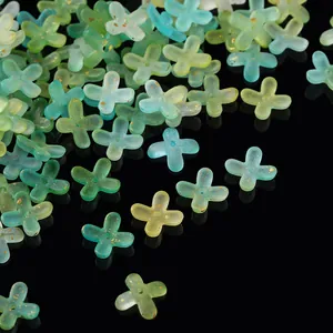 Detailed view of frosted acrylic flower beads with gold foil flecks in gradient colors