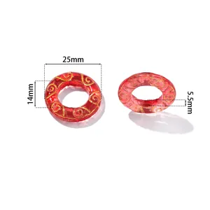 Detailed view of red translucent glaze beads with 25mm diameter and gold patterns
