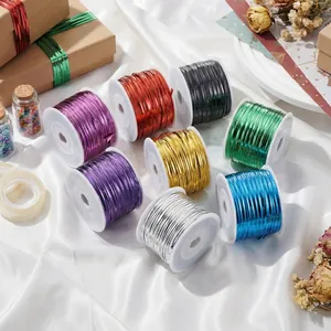 Multiple rolls of colorful metallic PET twist ties for gift packaging and sealing.