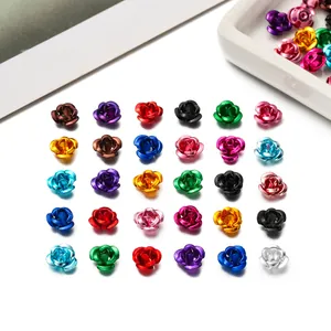 Detailed macro shot of colorful mini aluminum rose beads for DIY jewelry making.