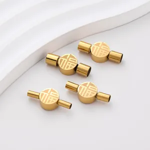 Detailed view of golden stainless steel Fu character clasps for DIY jewelry making.