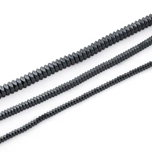 Macro view of faceted black hematite rhombus beads for professional DIY jewelry making.
