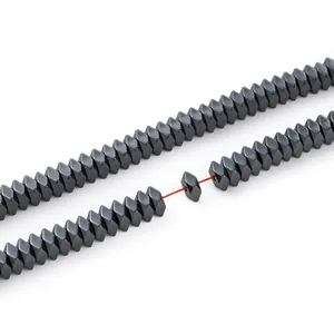 Macro detail of faceted black hematite diamond beads for DIY handmade jewelry making.