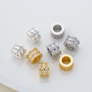 Macro detail of gold and silver micro-pave cubic zirconia barrel beads for jewelry making