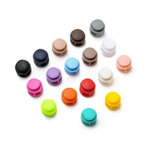 Collection of vibrant colorful plastic spring cord locks for face masks and apparel drawstring