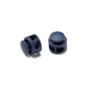 Macro view of navy blue double-hole plastic spring cord locks for elastic drawstrings
