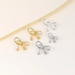 Detailed view of high-quality gold and silver plated bow spacer beads for DIY jewelry