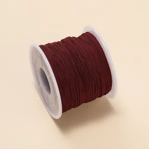 Bobine de fil de jade marron de 0,6 mm pour la fabrication de bijoux artisanaux et le tissage.