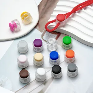 Detailed macro view of colorful plastic spring cord locks for masks and garment adjustment