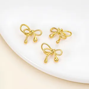 Detail of gold-plated copper bow beads with waterdrop design for jewelry DIY