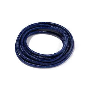 Detailed macro view of 3.0mm deep blue waxed polyester cord with braided snake-skin texture